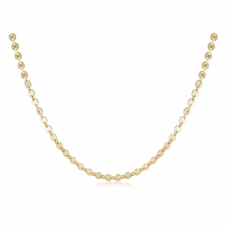 Gold necklace on a white background enewton