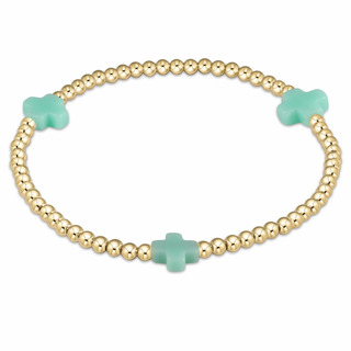 Gold bracelet with turquoise clover-shaped beads on a white background enewton