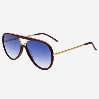 Aviator sunglasses with blue gradient lenses and gold frames on a white background