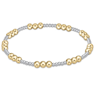 Two-tone gold and silver beaded bracelet on a white background by enewton