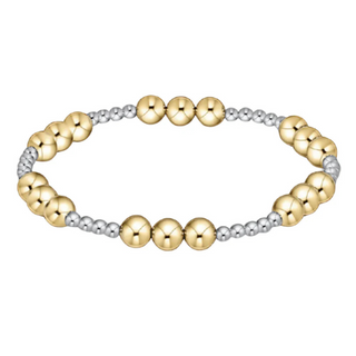 Bracelet with gold and silver beads on a white background by e newton