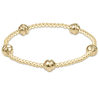 Gold bracelet with beaded design on a white background by e newton