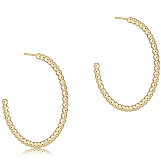 Gold beaded hoop earrings on a white background by enewton