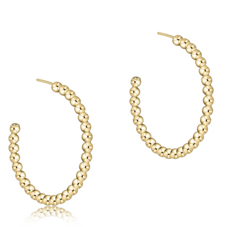 Gold hoop earrings with beaded design on a white background by enewton