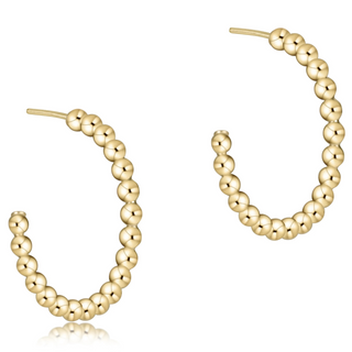Gold beaded hoop earrings on a white background by enewton